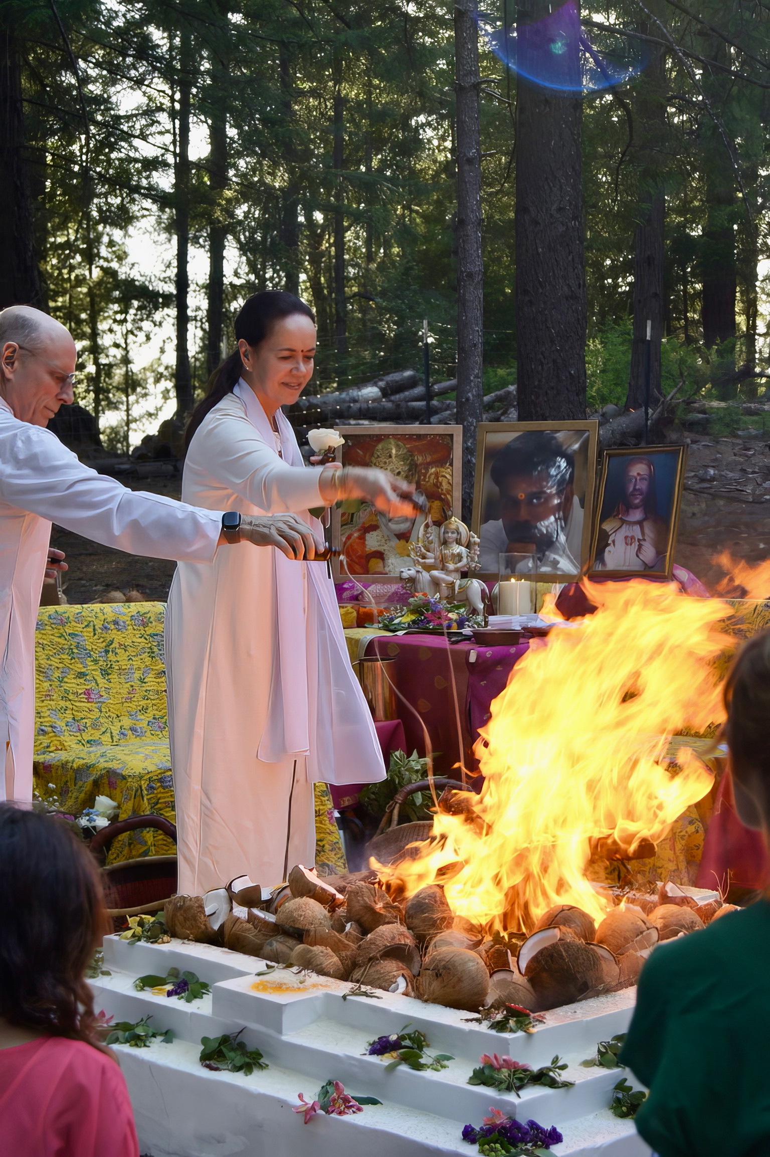 Monika 'Mataji' of Penukonda and Nityanandaji leading a fire puja at the Divine Mother Center